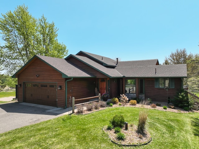 14177 205th St N, Scandia, MN 55073 - view of front of house featuring a garage, asphalt driveway, a front yard, and roof with shingles