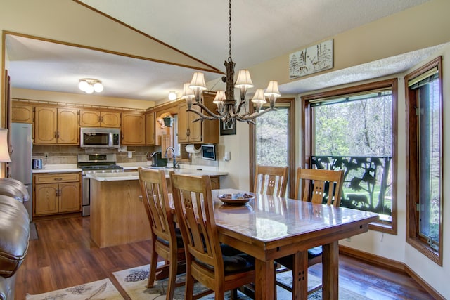 14177 205th St N, Scandia, MN 55073 - dining area with a chandelier, dark wood finished floors, and vaulted ceiling