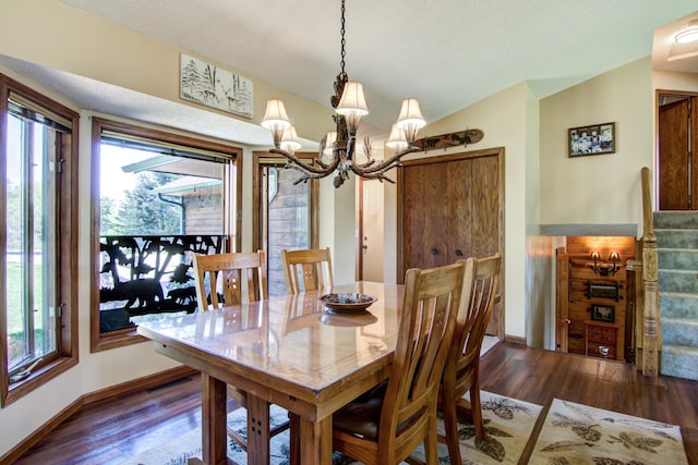 14177 205th St N, Scandia, MN 55073 - dining area with a chandelier, plenty of natural light, wood finished floors, and vaulted ceiling
