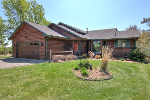 14177 205th St N, Scandia, MN 55073 - view of front of home featuring a garage, asphalt driveway, a front lawn, and roof with shingles