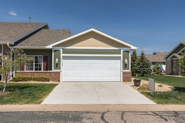 3973 Station Pl NW, Prior Lake, MN 55372 - view of front of house featuring brick siding, a front lawn, a garage, driveway, and roof with shingles