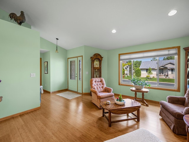 2200 142nd Ln NW, Andover, MN 55304 - living room with light wood finished floors, vaulted ceiling, baseboards, and recessed lighting