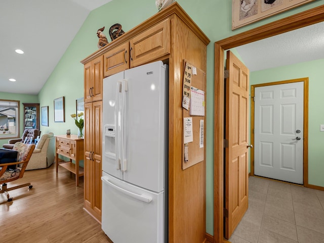2200 142nd Ln NW, Andover, MN 55304 - kitchen with white refrigerator with ice dispenser, vaulted ceiling, open floor plan, recessed lighting, and light wood-style floors