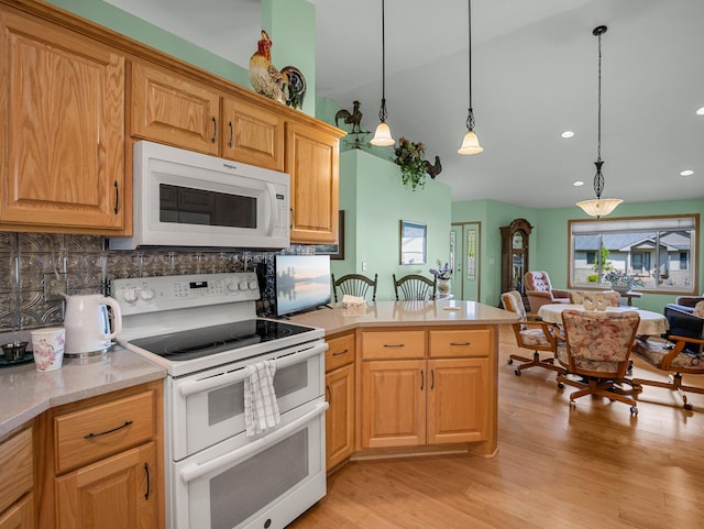 2200 142nd Ln NW, Andover, MN 55304 - kitchen featuring white appliances, decorative backsplash, light countertops, light wood-style floors, and recessed lighting