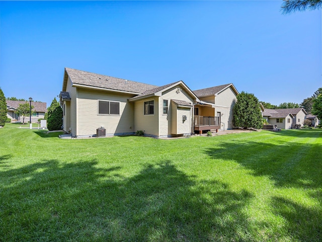 2200 142nd Ln NW, Andover, MN 55304 - rear view of property featuring a yard, central air condition unit, and a wooden deck