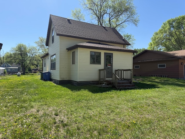 408 Jefferson St, Minneota, MN 56264 - back of property featuring a lawn and roof with shingles