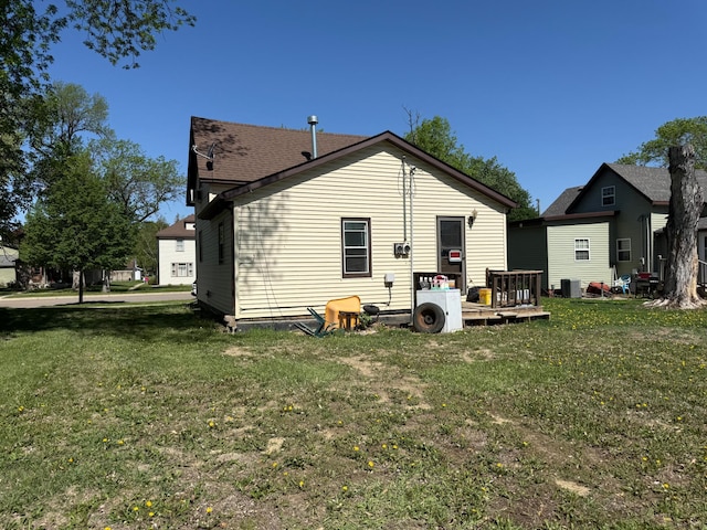 408 Jefferson St, Minneota, MN 56264 - back of property featuring a yard and roof with shingles