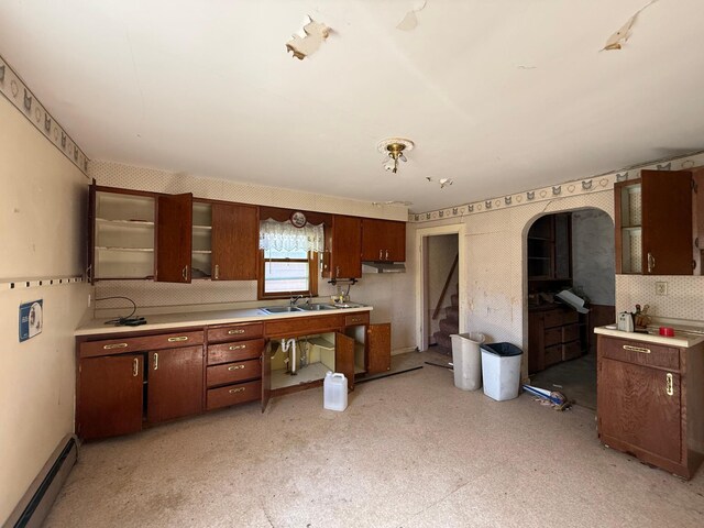 408 Jefferson St, Minneota, MN 56264 - kitchen featuring a baseboard radiator, light countertops, and a sink