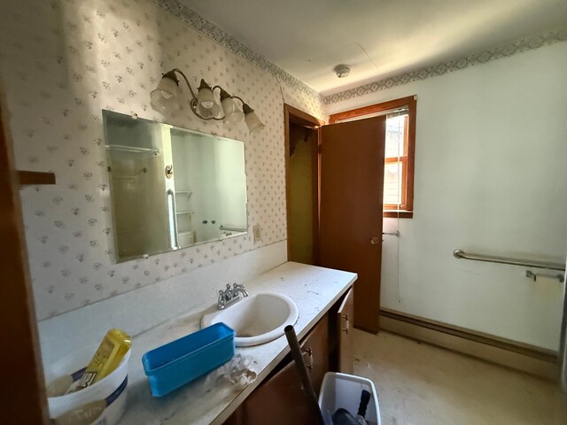 408 Jefferson St, Minneota, MN 56264 - bathroom with wallpapered walls, a baseboard heating unit, vanity, and a shower