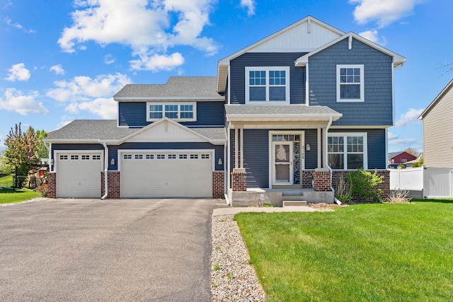 view of front of house with a garage, asphalt driveway, brick siding, and roof with shingles