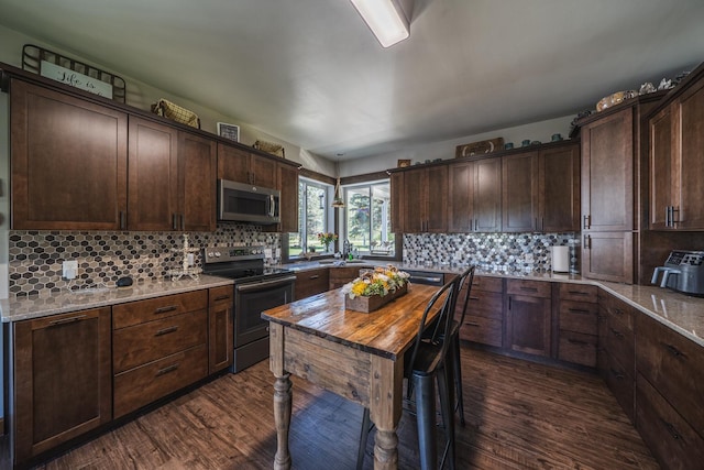 28571 Buffalo Lake Rd, Richwood Twp, MN 56521 - kitchen featuring stainless steel appliances, dark wood-style flooring, and decorative backsplash