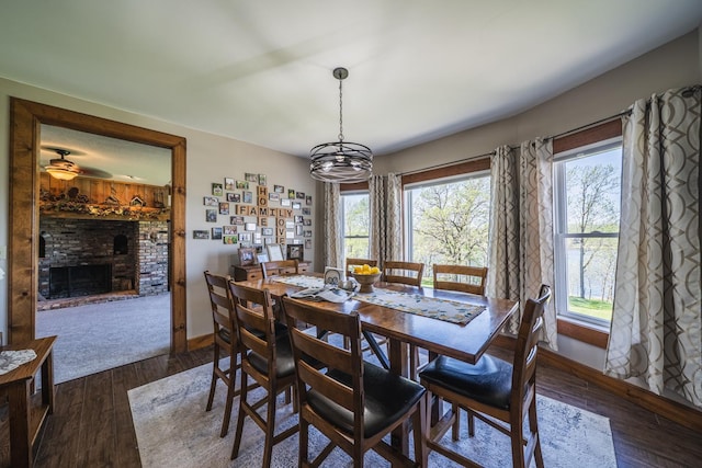 28571 Buffalo Lake Rd, Richwood Twp, MN 56521 - dining area featuring baseboards, healthy amount of natural light, and a brick fireplace