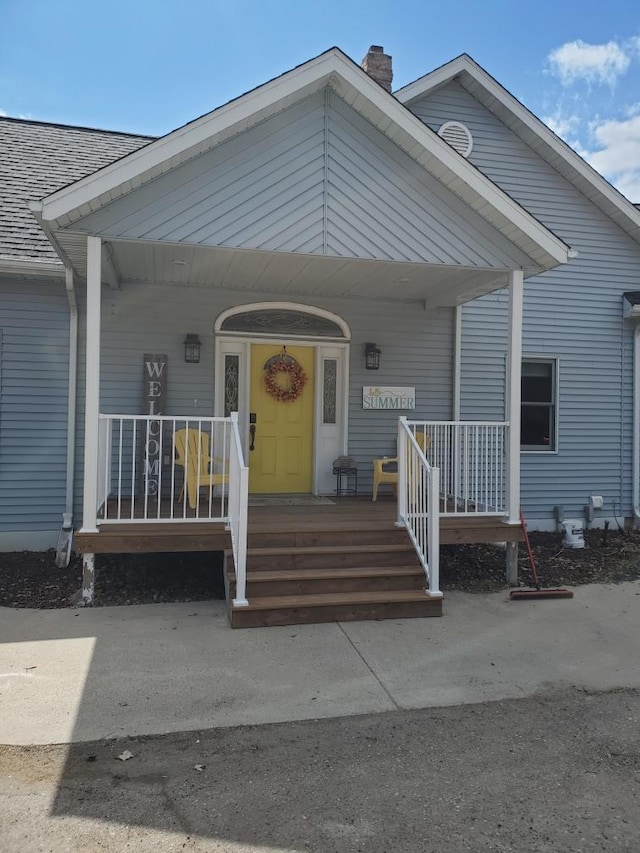 28571 Buffalo Lake Rd, Richwood Twp, MN 56521 - view of front facade with a chimney, a porch, and roof with shingles