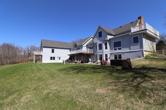 28571 Buffalo Lake Rd, Richwood Twp, MN 56521 - rear view of property featuring a balcony, a yard, and a chimney