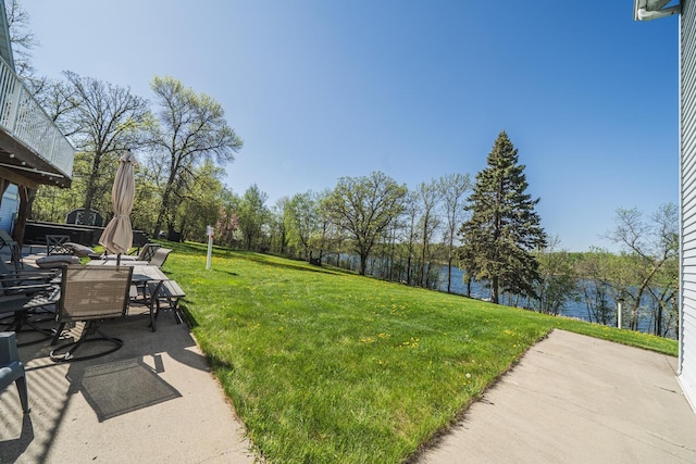 28571 Buffalo Lake Rd, Richwood Twp, MN 56521 - view of green lawn with a water view, a patio, and outdoor dining space