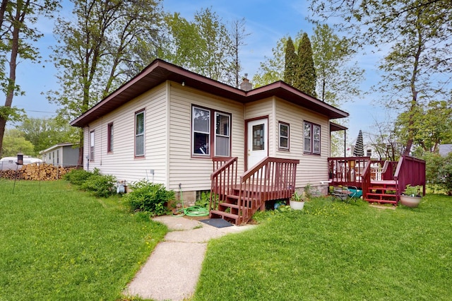235 2nd Ave N, Isle, MN 56342 - view of front of property featuring a front lawn, a wooden deck, and a chimney