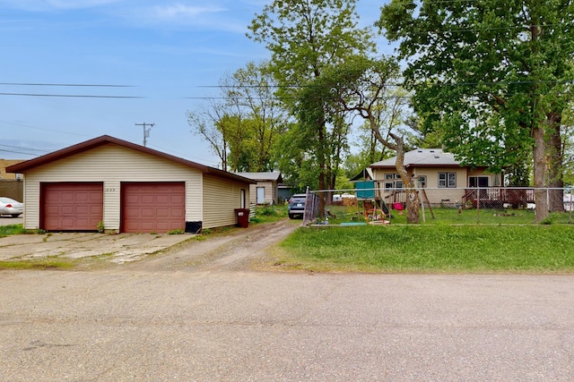 235 2nd Ave N, Isle, MN 56342 - view of front of house featuring a detached garage and an outbuilding