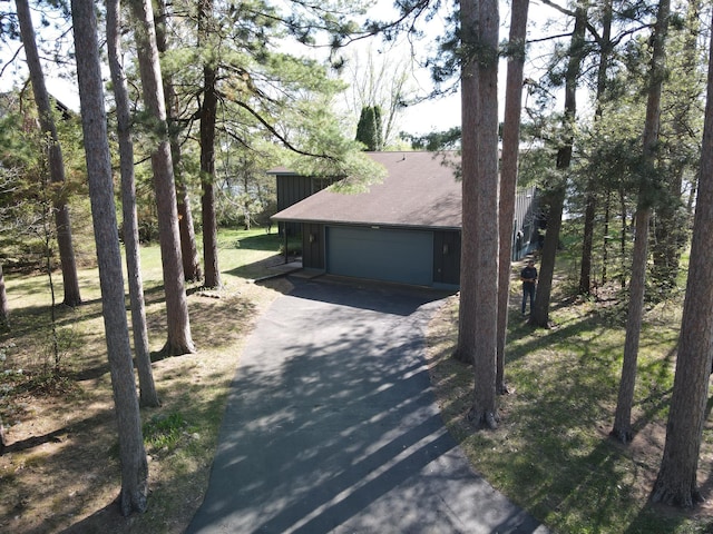 10415 Sorenson Dr, Hayward, WI 54843 - view of front of house with a garage, asphalt driveway, and a shingled roof