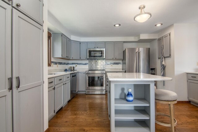 10415 Sorenson Dr, Hayward, WI 54843 - kitchen with stainless steel appliances, gray cabinetry, a center island, and recessed lighting