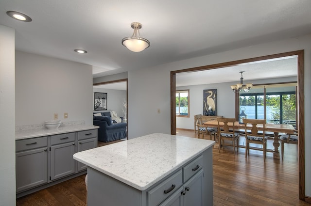 10415 Sorenson Dr, Hayward, WI 54843 - kitchen with gray cabinetry, a chandelier, dark wood-style floors, decorative light fixtures, and recessed lighting