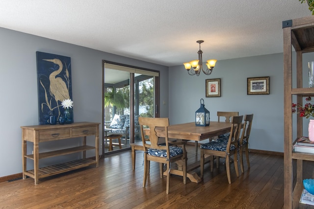 10415 Sorenson Dr, Hayward, WI 54843 - dining room with hardwood / wood-style flooring, a chandelier, baseboards, and a textured ceiling