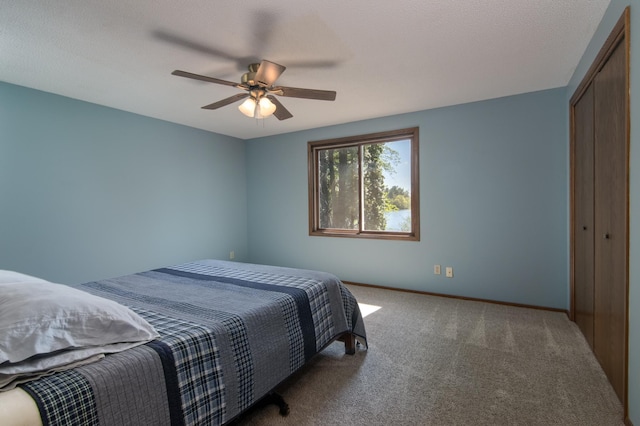 10415 Sorenson Dr, Hayward, WI 54843 - bedroom with carpet flooring, a closet, ceiling fan, and baseboards