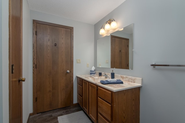 10415 Sorenson Dr, Hayward, WI 54843 - bathroom featuring wood finished floors and vanity