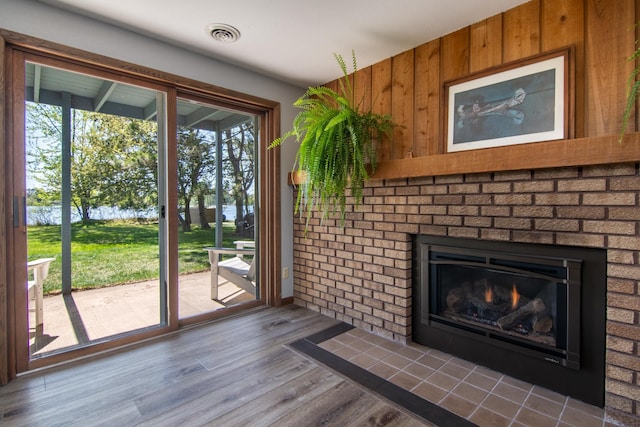 10415 Sorenson Dr, Hayward, WI 54843 - entryway with wood finished floors and a brick fireplace