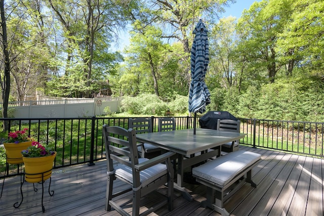 514 10th St N, Sartell, MN 56377 - deck with outdoor dining space and a grill