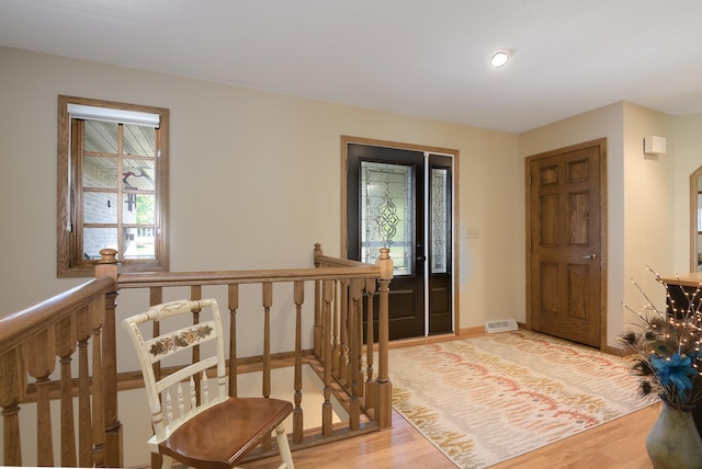 514 10th St N, Sartell, MN 56377 - entryway featuring light wood finished floors, baseboards, and recessed lighting