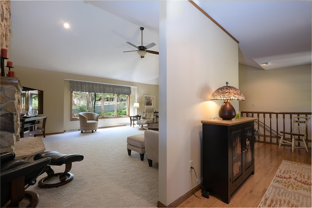 514 10th St N, Sartell, MN 56377 - living area with ceiling fan, baseboards, high vaulted ceiling, and light carpet