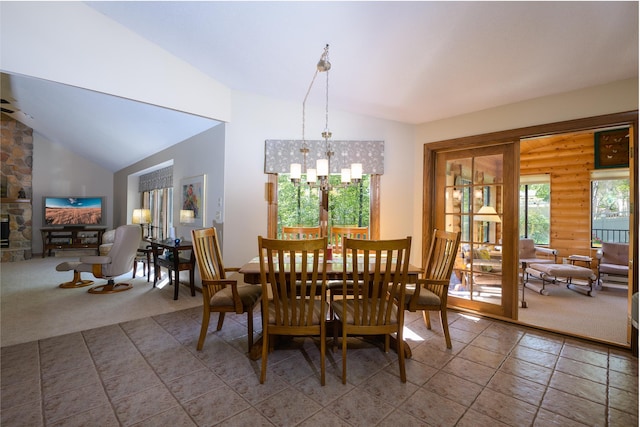 514 10th St N, Sartell, MN 56377 - carpeted dining space featuring vaulted ceiling, a fireplace, and a chandelier
