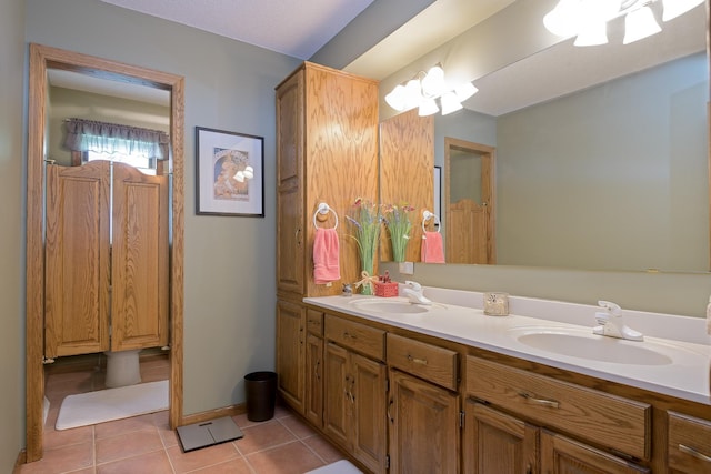 514 10th St N, Sartell, MN 56377 - full bath featuring tile patterned flooring, double vanity, and baseboards