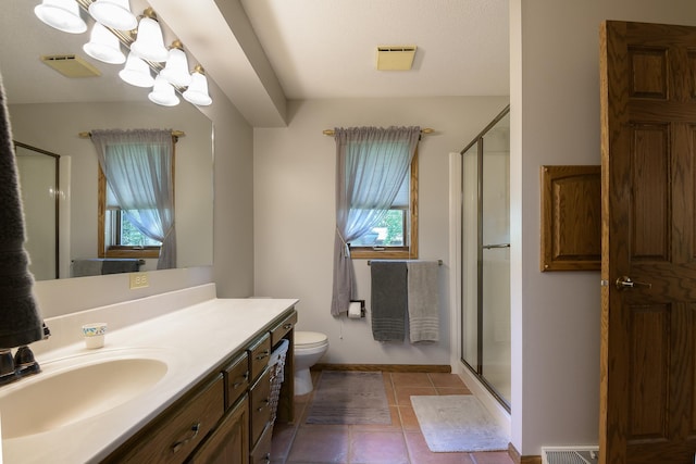 514 10th St N, Sartell, MN 56377 - bathroom with a shower stall, vanity, tile patterned flooring, and toilet