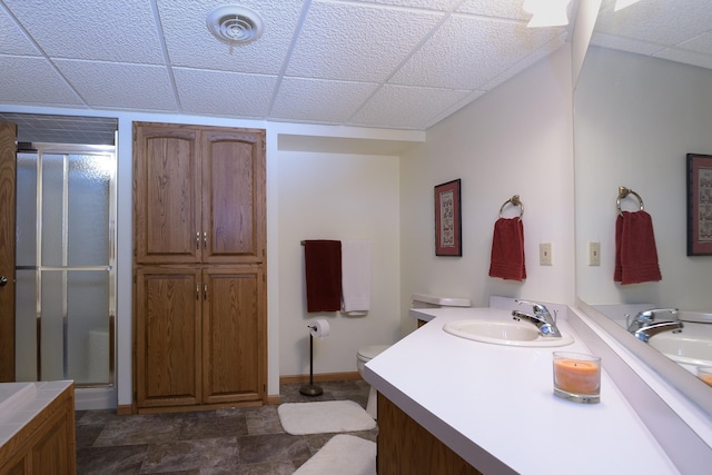514 10th St N, Sartell, MN 56377 - bathroom with a stall shower, vanity, a drop ceiling, and baseboards