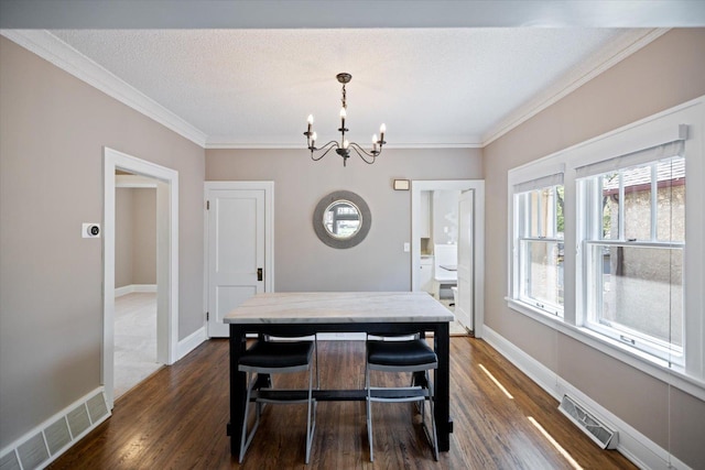 4505 47th Ave S, Minneapolis, MN 55406 - dining space with a chandelier, dark wood-type flooring, ornamental molding, and baseboards