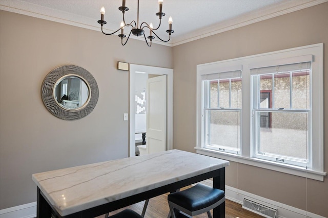4505 47th Ave S, Minneapolis, MN 55406 - dining space with a chandelier, ornamental molding, baseboards, and dark wood finished floors