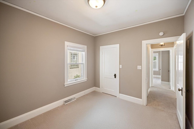 4505 47th Ave S, Minneapolis, MN 55406 - unfurnished bedroom with ornamental molding, light colored carpet, and baseboards