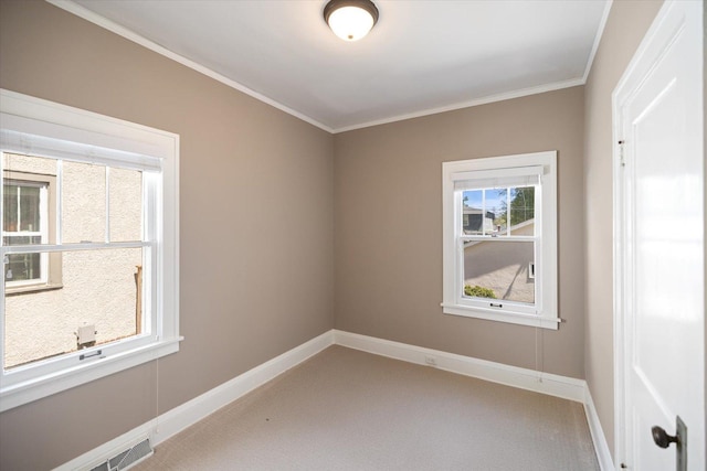 4505 47th Ave S, Minneapolis, MN 55406 - carpeted empty room with baseboards and ornamental molding