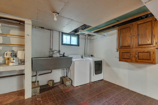 506 Riverside Dr SE, Saint Cloud, MN 56304 - washroom featuring separate washer and dryer and brick patterned floors