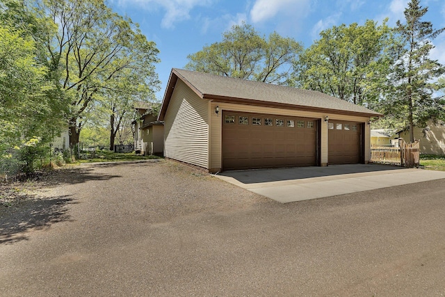 506 Riverside Dr SE, Saint Cloud, MN 56304 - garage featuring driveway and fence