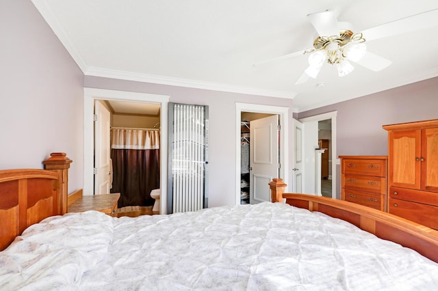 bedroom with ornamental molding, a spacious closet, a closet, connected bathroom, and a ceiling fan