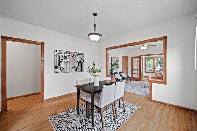3608 Park Ave Unit 102, Minneapolis, MN 55407 - dining room with baseboards, light wood-style floors, and ceiling fan