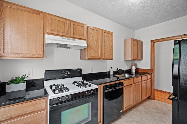 3608 Park Ave Unit 102, Minneapolis, MN 55407 - kitchen featuring black appliances, under cabinet range hood, a sink, a textured ceiling, and dark stone countertops