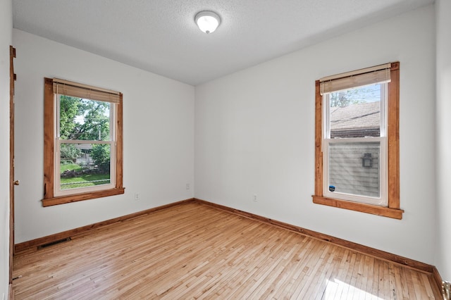 3608 Park Ave Unit 102, Minneapolis, MN 55407 - unfurnished room featuring wood-type flooring and baseboards