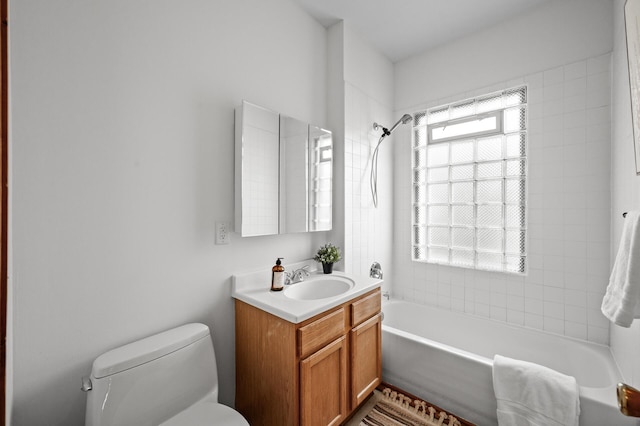 3608 Park Ave Unit 102, Minneapolis, MN 55407 - bathroom featuring vanity, toilet, and shower / tub combination