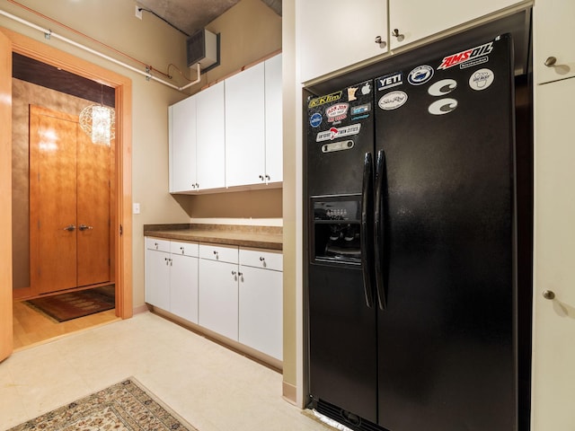 100 2nd St NE Unit A270, Minneapolis, MN 55413 - kitchen with black fridge, white cabinets, and dark countertops