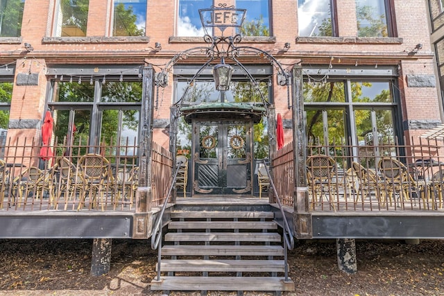 100 2nd St NE Unit A270, Minneapolis, MN 55413 - property entrance featuring brick siding and a wooden deck