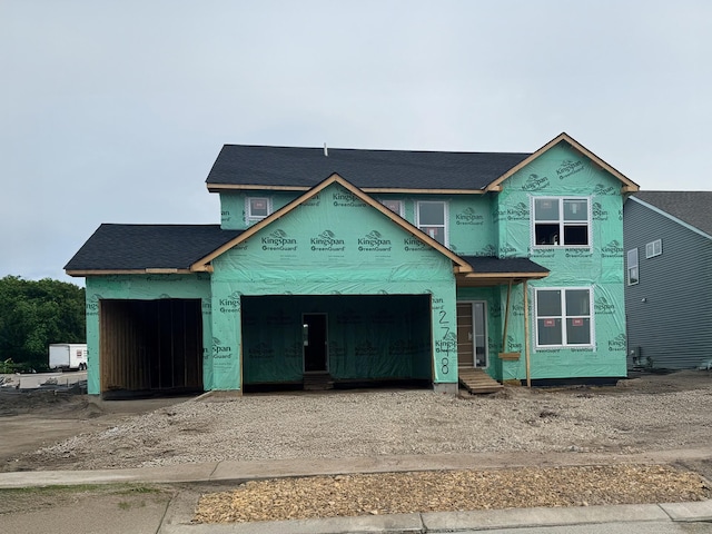 2748 Aspen Dr, Shakopee, MN 55379 - property under construction featuring driveway, an attached garage, and roof with shingles