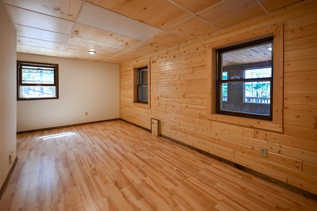 1192 Blackburn Rd, Scott Twp, WI 54801 - unfurnished room featuring wood walls, wood ceiling, baseboards, and light wood finished floors